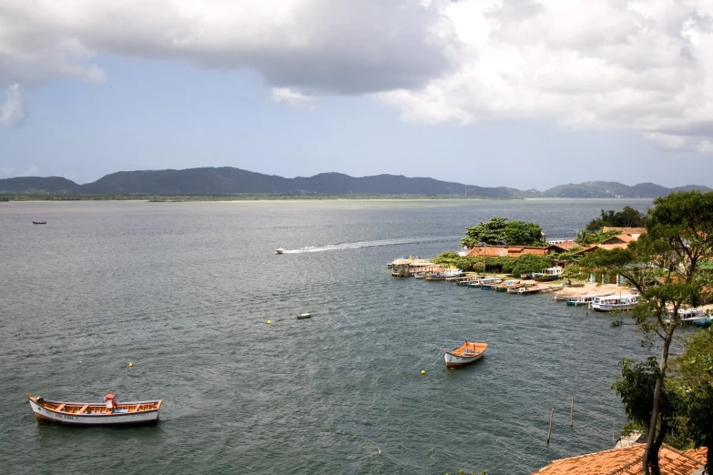 several boats floating in the middle of the water