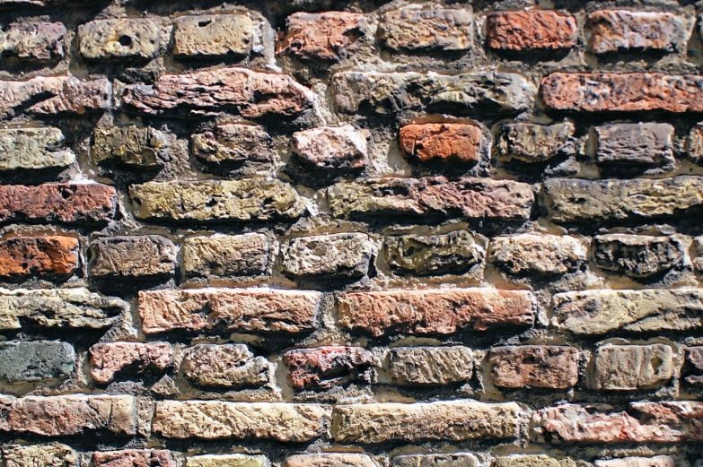 a close up of a brick wall with bricks on it