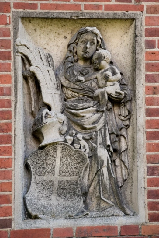 an intricately carving on the wall of a brick building