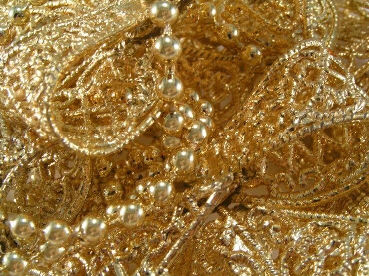 a close - up image of some shiny beads