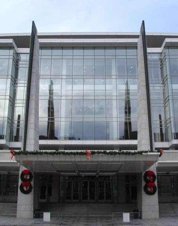 a building with two large doors and several lights outside