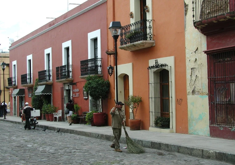 a man on the street and people in the background