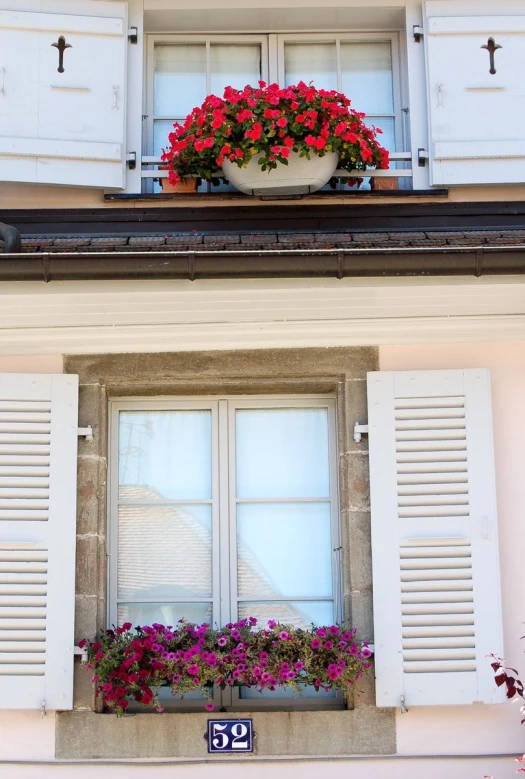 a window with many windows and shutters on both sides