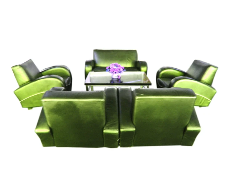 the room is equipped with a set of green velvet furniture