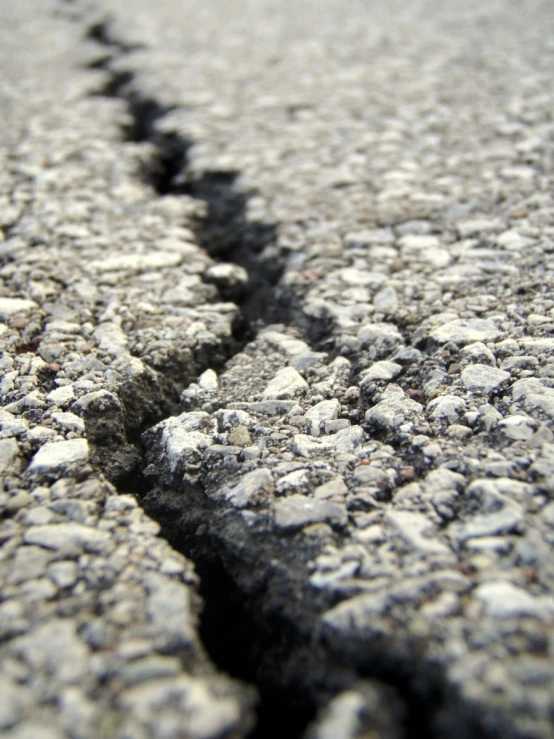 a  in the asphalt shows that people have been left without contact with it