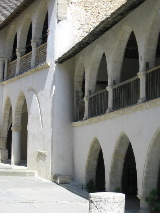 an old building with multiple arches and windows