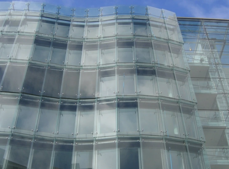 an exterior s of a glass building that has various windows