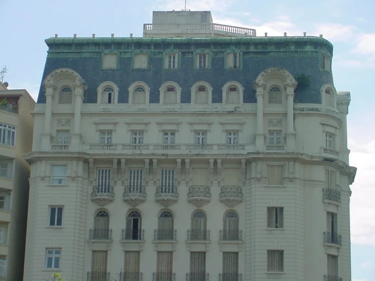 the building is very large and ornate with its large balconies