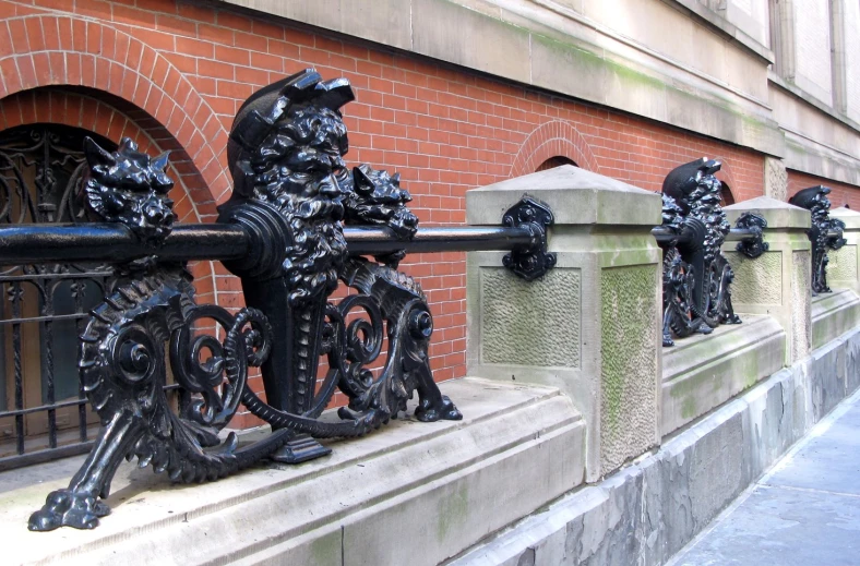 a set of ornate black iron gate ckets