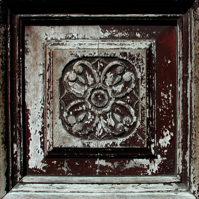 close up of an old door and chipping paint on it