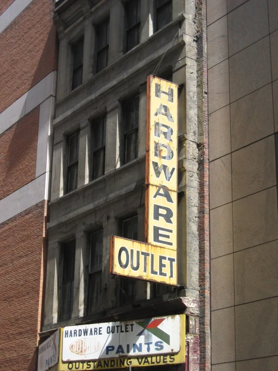 a building with a variety of signage attached to it