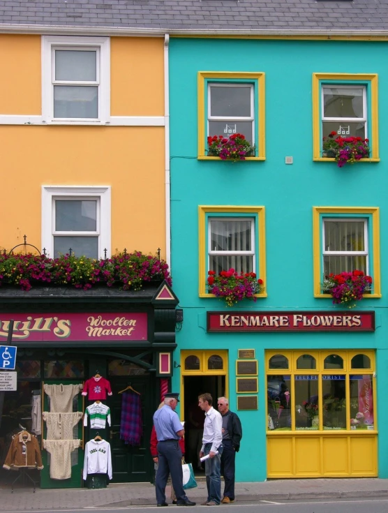 people walking past an antique florists on the street