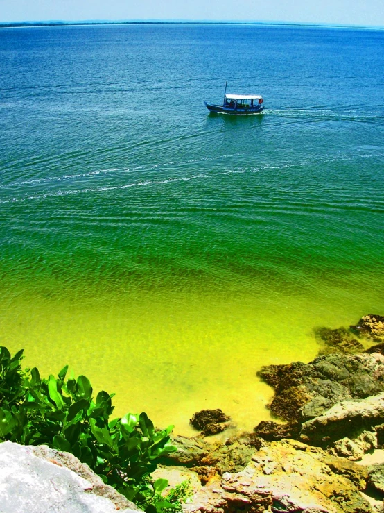 a small boat is out in the ocean