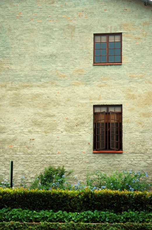 the two windows are closed on the side of the building