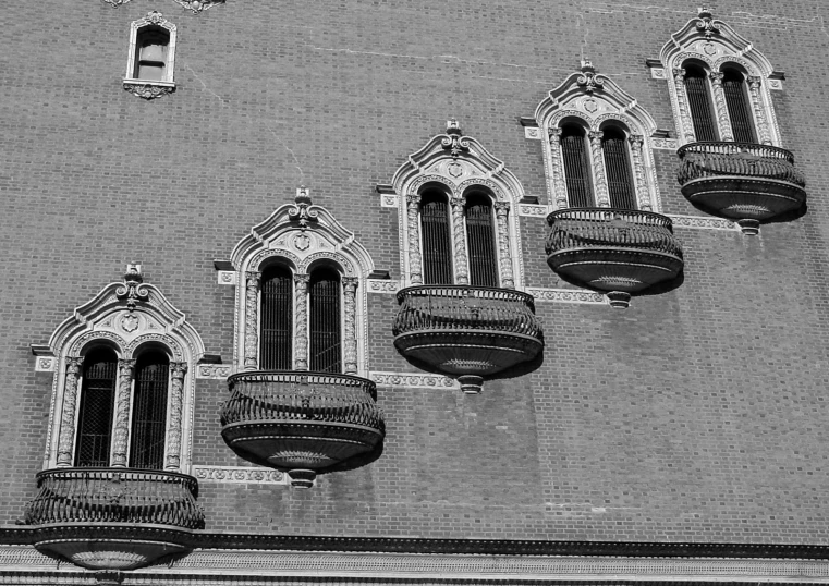 many small window on a building with lots of balconies