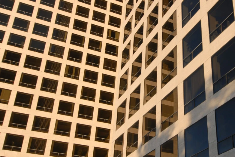 a very large building with some windows and a stop sign