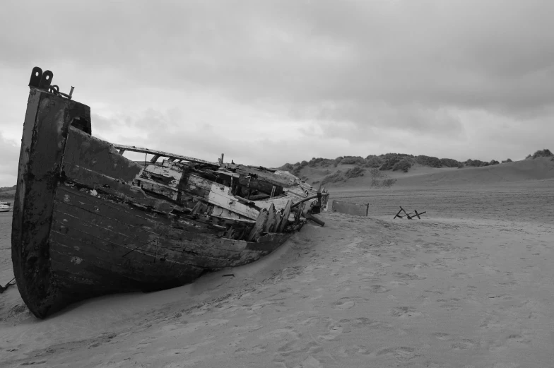 old ship left sitting on top of the sand