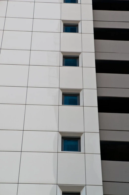 a white building with three small windows