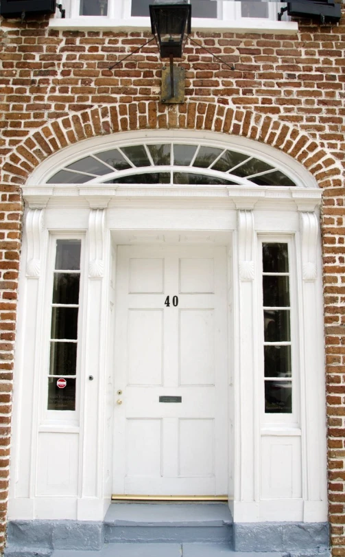 a brick building with two open doors