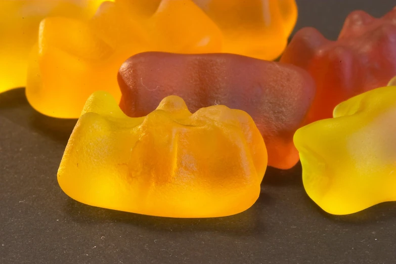 some gummy bears are arranged in a row