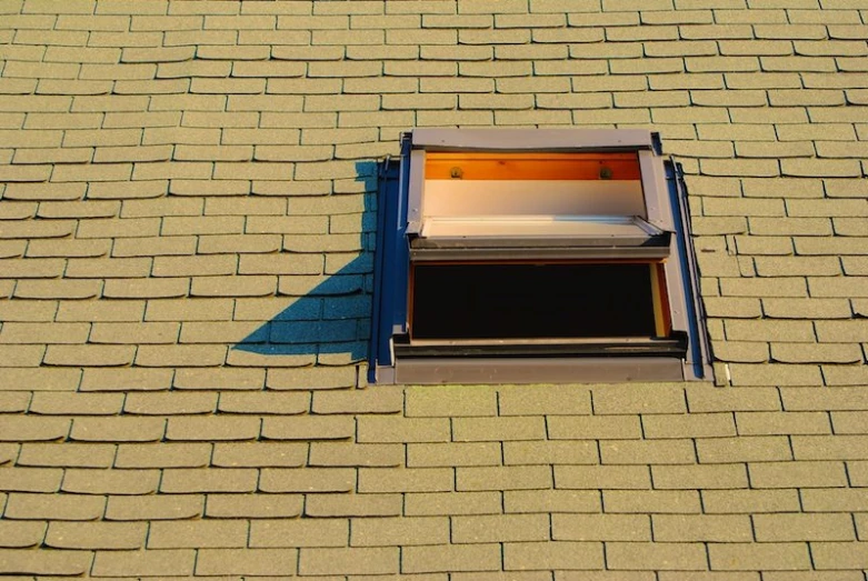 the roof with an open window and a flat screen tv