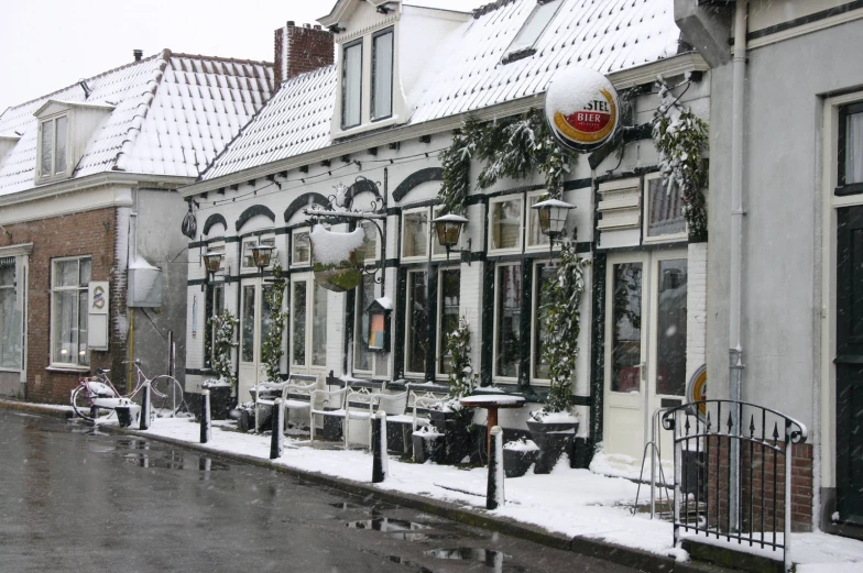 a row of white houses covered in snow