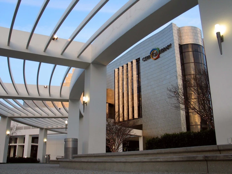 modern building with large arches over it, near a stairway