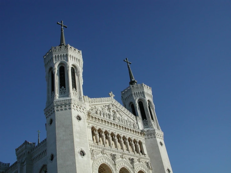 a large cathedral style church with a cross on the top