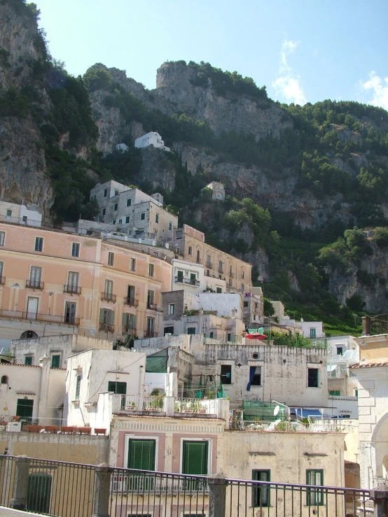 the city below the mountain is surrounded by buildings