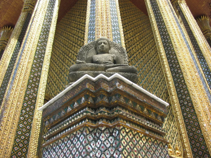 the ornate structure of the building has a lion statue