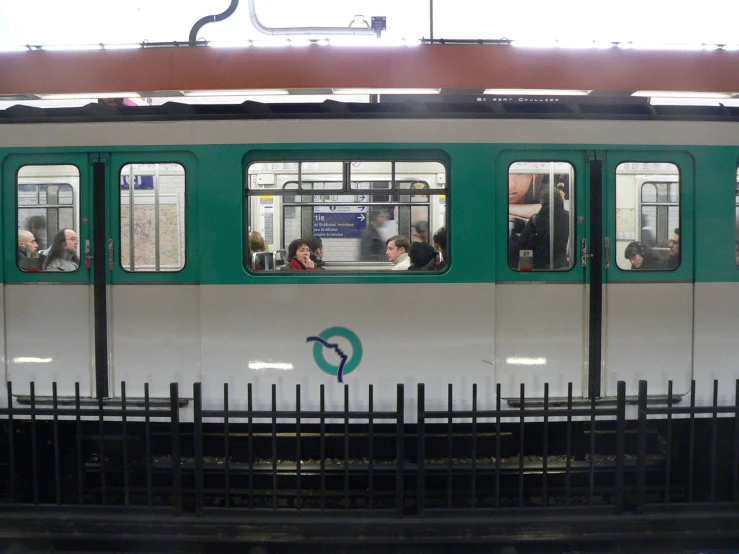 several people are in a public transit train