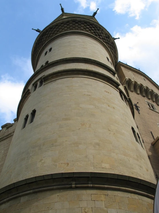 a clock mounted on the side of a large building