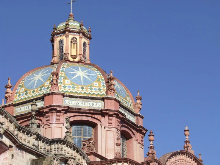 a building with a large dome has intricate designs