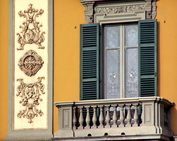 a building with a clock and decorative railing