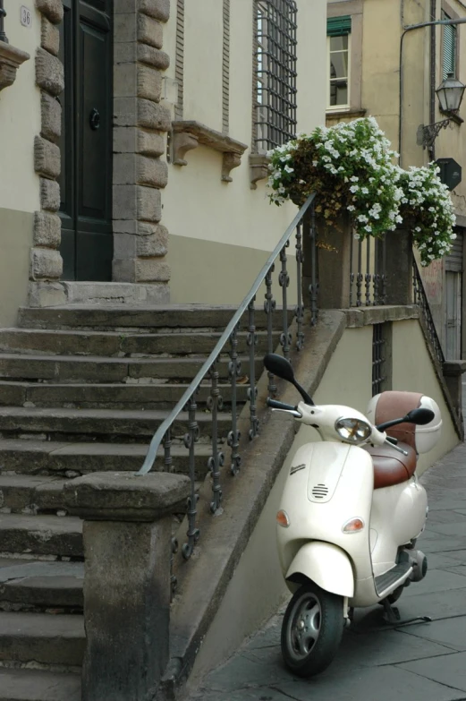 a scooter is parked near steps and stairs