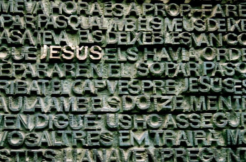 the word jesus in multiple different languages against a black background