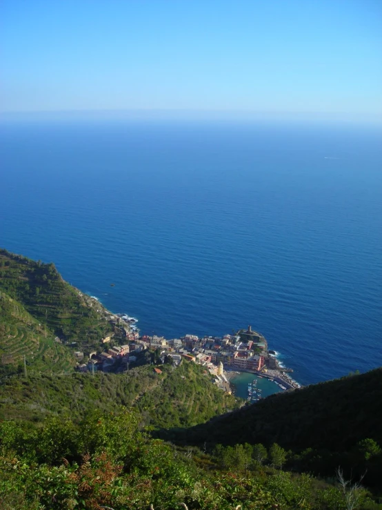 the town on the shore of a lake sits atop a mountain