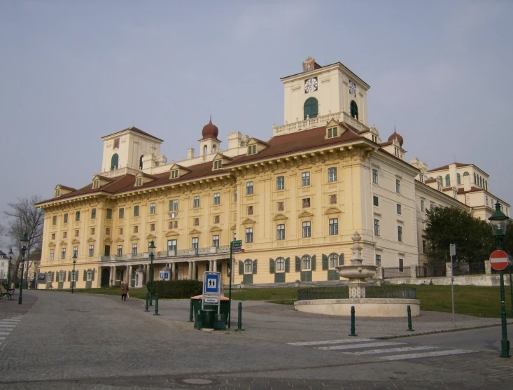 a building with many windows and a big clock tower