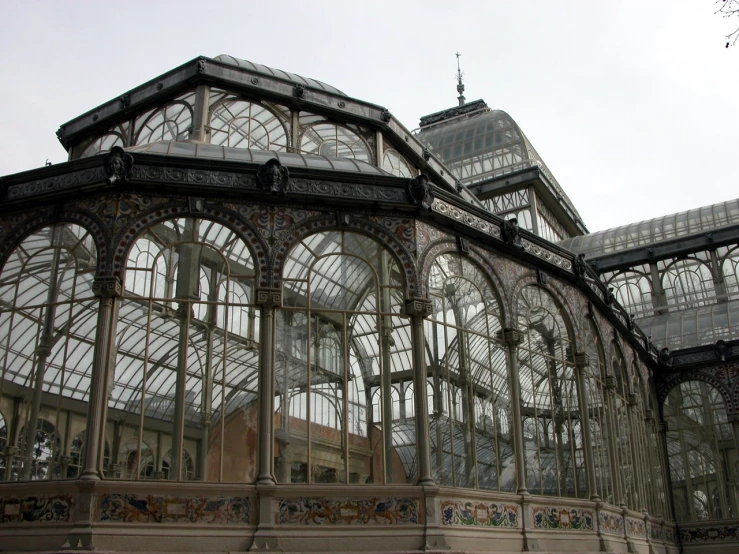 an ornate glass house built in to the ground