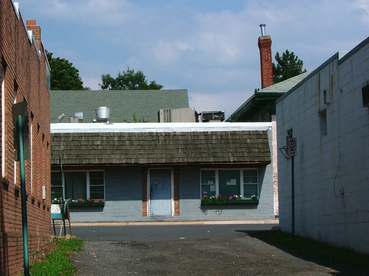 an empty street with old buildings near by