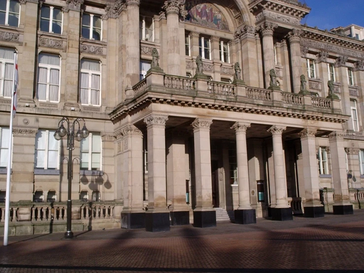 a large old building has two tall columns