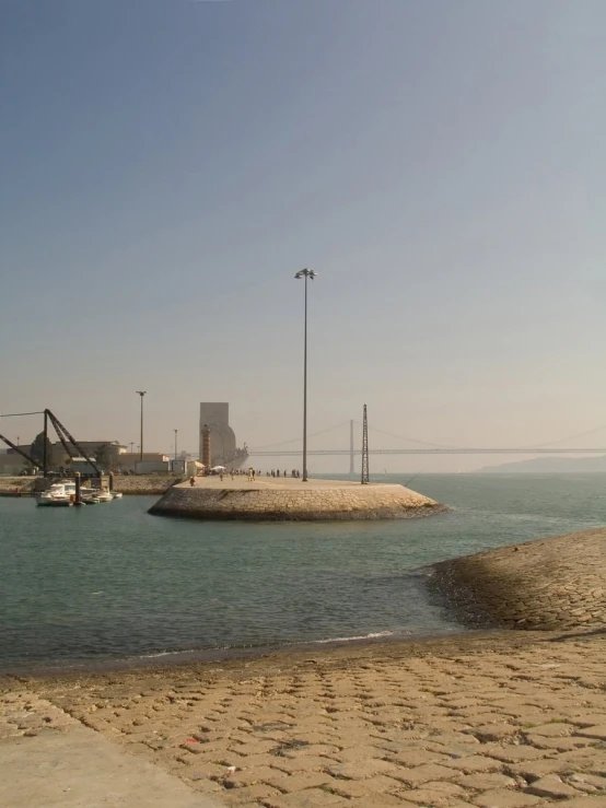 a beach that has a couple boats floating in it