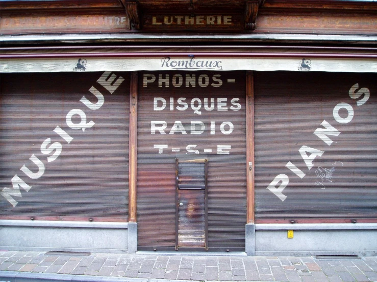 some signs that are on a storefront