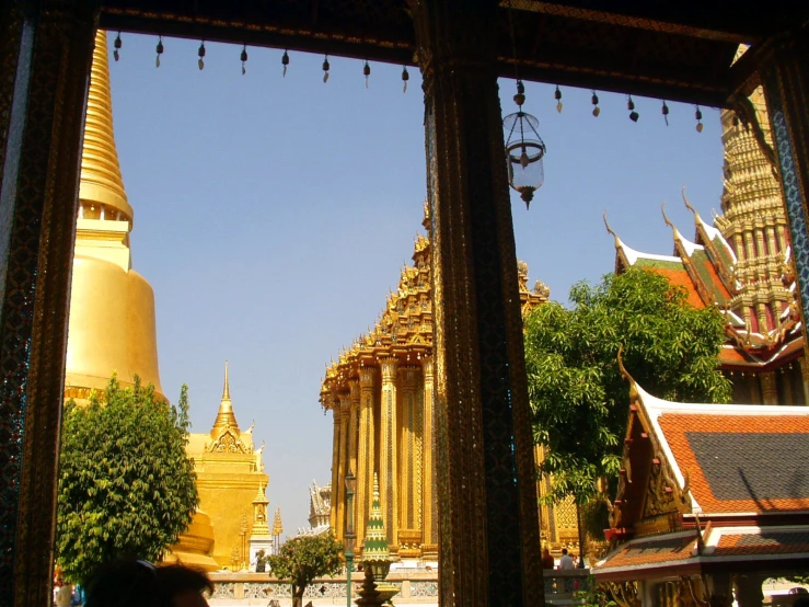 a small temple and big golden buildings