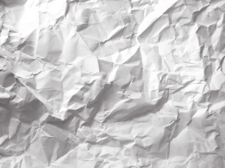 an abstract white crumpled background texture or paper