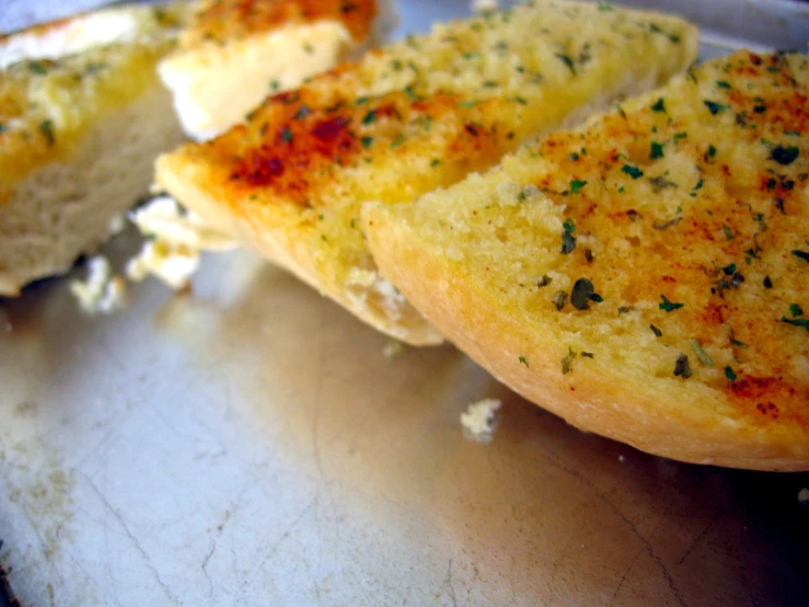 a piece of bread with herbs and cheese