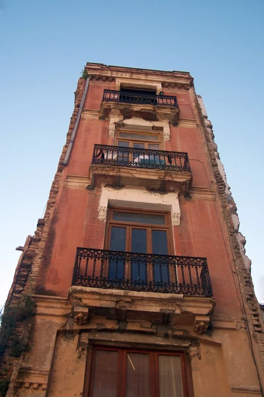 tall building has balconies and an outside balcony