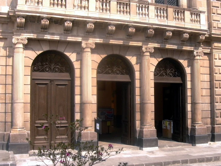 a large building with arched doorways on each side