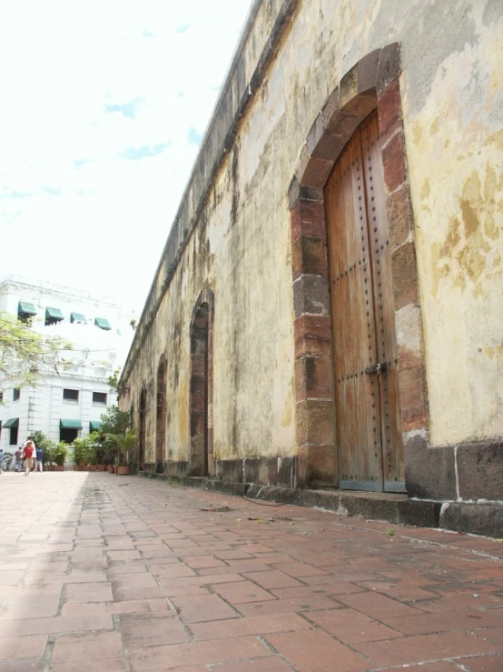 an old brick street with a large open doorway