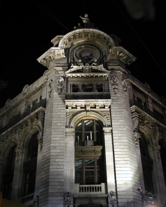 a large stone building lit up at night